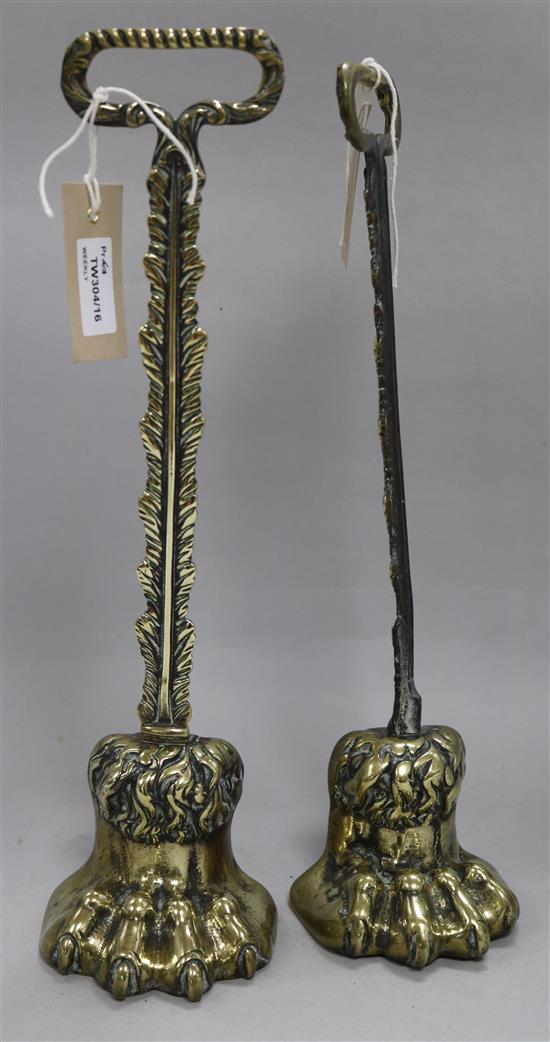 A pair of 19th century brass claw-foot doorstops